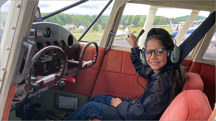 Girl Inside Airplane Cockpit