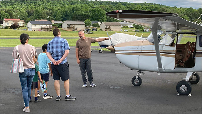 Airplane Instructor Talking to Public 