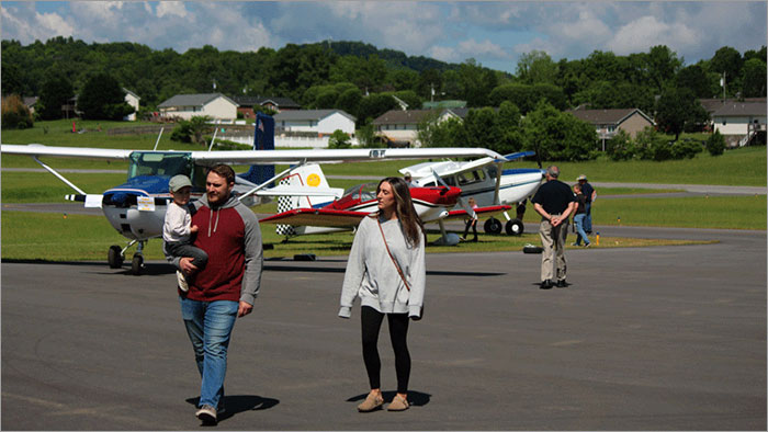 People Site Seeing the Planes and Runway